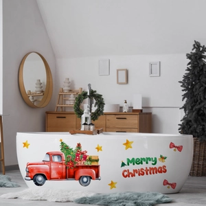Detail of vintage red truck and Merry Christmas stickers on a white bathtub wall
