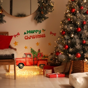 Detail of Christmas wall stickers featuring a vintage red truck and Merry Christmas text