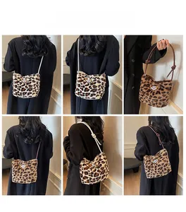Detail view of leopard print plush bucket bag showing soft texture and dual strap options
