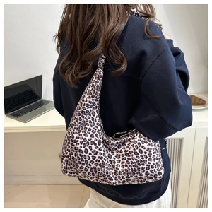 Stylish leopard print tote bag with large capacity shown in a casual lifestyle setting