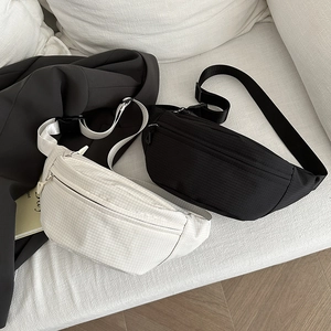 Minimalist nylon dumpling shoulder bag for women in off-white and black color options