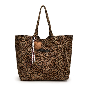 Large leopard print canvas tote bag with brown bear charm and red stripe detail