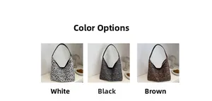 Three leopard print tote bags in white, black, and brown with slim black shoulder straps