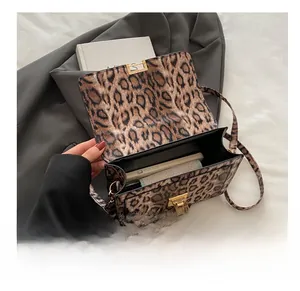 Detailed interior view of leopard print crossbody bag showing space for a smartphone