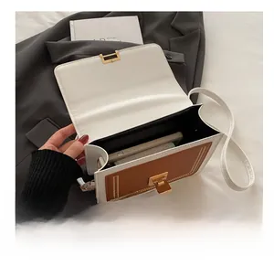Detailed interior view of a contrast panel crossbody bag showing its phone storage capacity
