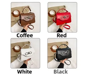 Detail of crossbody bag colors featuring rhinestone bow decor and leather texture