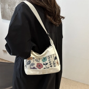 Fashionable creamy white tote bag with floral jacquard strap and adjustable wide shoulder belt