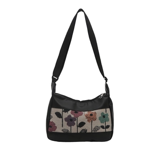 Retro black crossbody bag with colorful floral jacquard pattern and wide strap