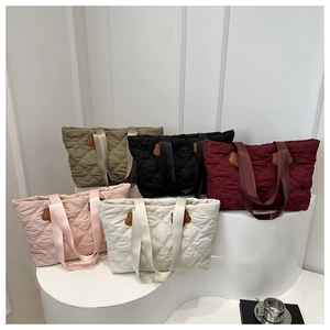 Quilted large capacity tote bags in multiple colors featuring chic floral accents