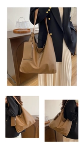 Detail of caramel leather tote bag showing spacious design and matching zipper pouch