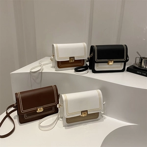 French embroidered crossbody bags in four colorways with gold clasp and topstitching