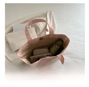 Roze tote bag met grote capaciteit voor telefoon, portemonnee en een paraplu
