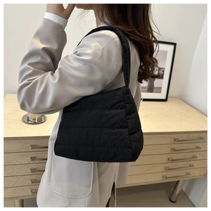 Quilted padded shoulder bag in black nylon with puffer texture for daily commuting