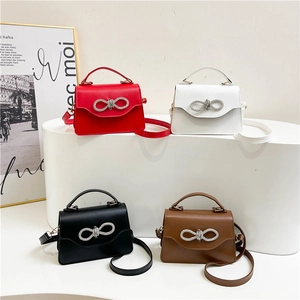Structured leather bow crossbody bags in red, white, black and mocha brown colors