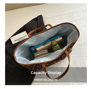 Spacious leopard print tote bag interior showing capacity for tablet and essentials
