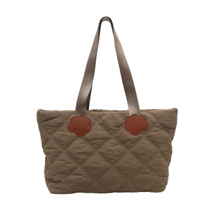 Quilted khaki tote bag with large capacity and decorative orange floral leather patches