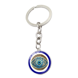 Close-up of Turkish Blue Evil Eye keychain with silver geometric metal detailing