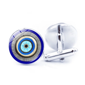 Macro view of blue Evil Eye cufflinks with round glass dome and silver metal base