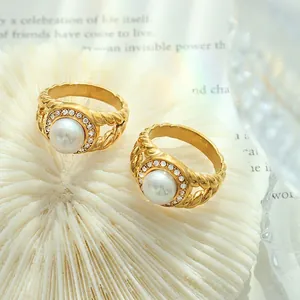 Vintage 18K gold plated ring with freshwater pearl and zircon stones on white coral