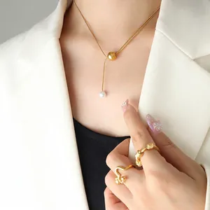 Collier en titane doré avec pendentif perle et ensemble de bagues tendance pour femme