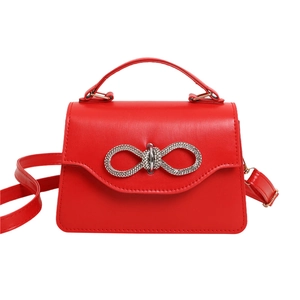 Chic red mini PU leather handbag featuring a sparkling rhinestone bow buckle and gold hardware