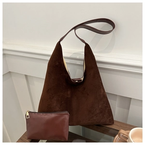 Macro detail of dark brown matte suede tote bag set with a matching zipper pouch