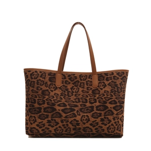 Fashionable leopard print tote bag with brown leather handles on a white background