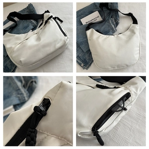 Detail shots of white half-moon crossbody bag with black straps and zipper accents