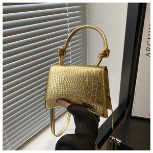 Golden crocodile embossed mini square handbag with top handle and shoulder strap