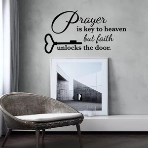 Detail of inspirational prayer wall decal with heart key on modern grey living room wall