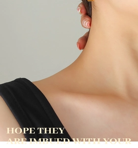 Close-up of a vintage heart earring in gold-plated steel worn by a fashion model