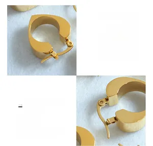 Detail of 18K gold plated surgical titanium steel hollow heart earrings with matte finish