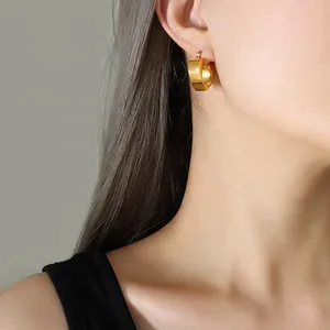 Minimalist chunky golden C-shape hoop earrings with high-quality brushed metal texture