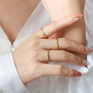 Three-piece gold-plated titanium steel rings set with red, green, and white zircon stones