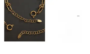 Detail of gold titanium steel jewelry chain with spring clasp and K18 hallmark tag