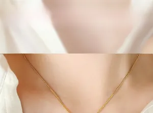 Close-up of a gold star-shaped pendant on a titanium steel curb chain necklace