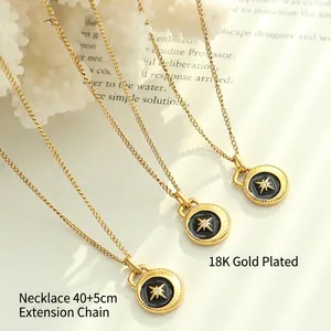 Vintage 18K gold plated necklace with black enamel starburst pendant and zircon stone