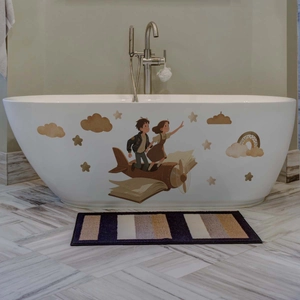 Cartoon boy and girl on book airplane wall decal on a white bathtub in cozy bathroom