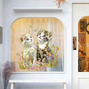 Close-up of static window sticker featuring kittens, floral garden and gold foil outlines