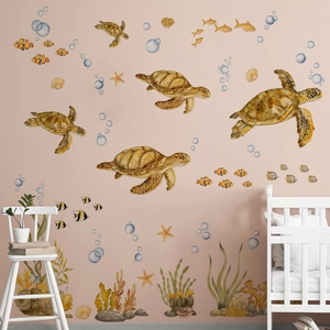 Nursery wall scene showing watercolor sea turtles and colorful coral reef stickers