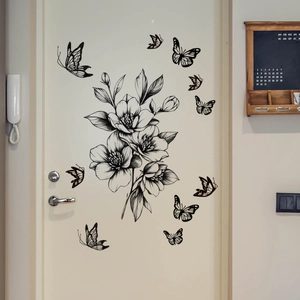 Minimalist black line flower and butterfly wall decals on white door for home decor