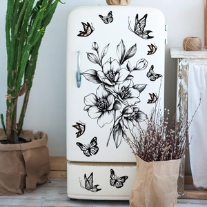 Detail of minimalist black floral line art and butterfly wall stickers on a fridge