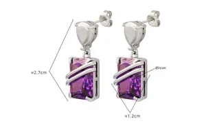 Close-up of hip-hop silver earrings with purple square zircon and diagonal metal bar