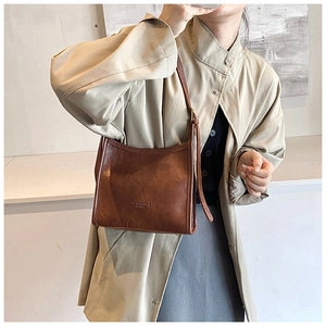 Minimalist dark brown leather shoulder bag for women with elegant retro underarm style