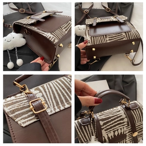 Detail of brown leather backpack featuring zebra texture fabric and golden bottom rivets