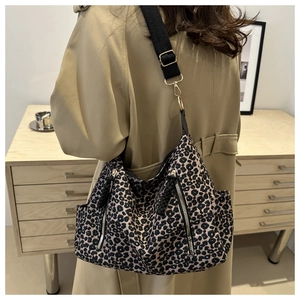 Retro leopard print tote bag with metal zippers and adjustable black wide shoulder strap