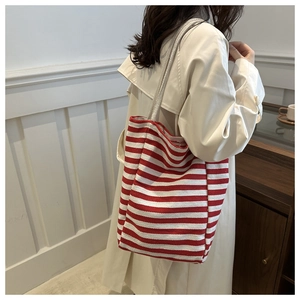 Detail of red and white striped canvas tote bag with thick cotton rope shoulder straps