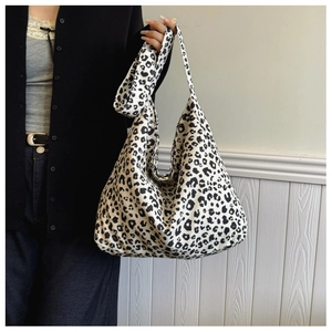 Leopard print canvas tote bag shown on model for a stylish casual look and large capacity