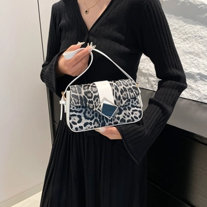 Chic leopard print underarm bag with white leather trim and geometric buckle closure