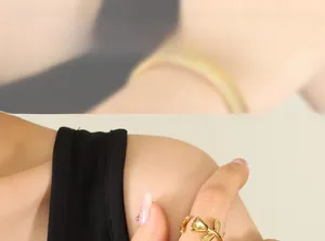 Detailed model shot of an 18k gold plated stainless steel rose ring on finger